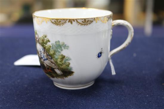 A Berlin cup and saucer, painted with birds and insects